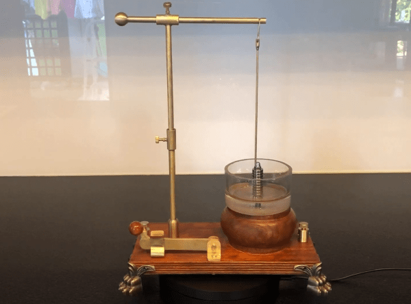 A brass-and-wood replica of Faraday's motor